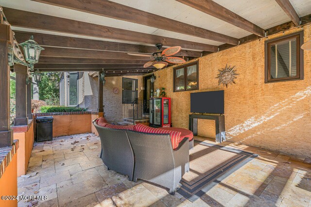 view of patio / terrace featuring ceiling fan