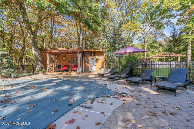 exterior space featuring a patio and an outdoor structure