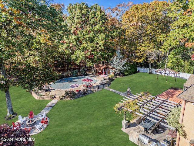 view of yard with a fire pit