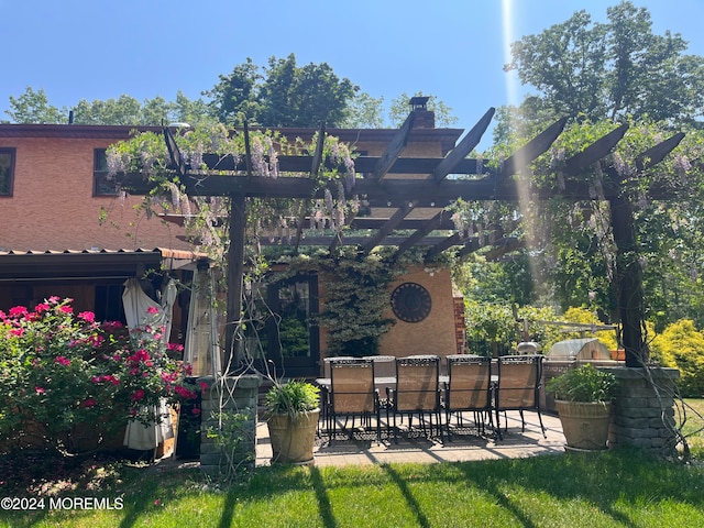 view of yard with a pergola and a patio