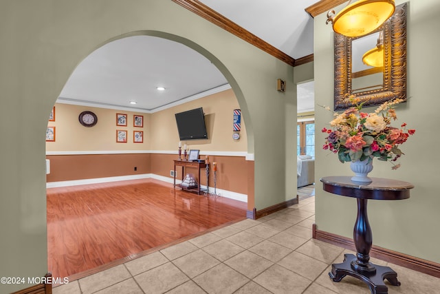 interior space featuring hardwood / wood-style flooring and ornamental molding