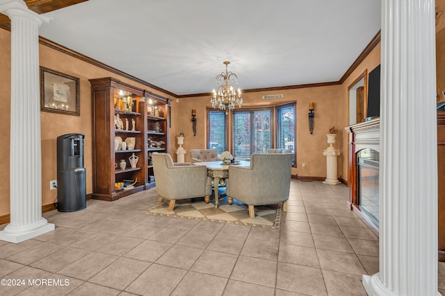 dining area with ornate columns, built in shelves, crown molding, a chandelier, and light tile patterned floors