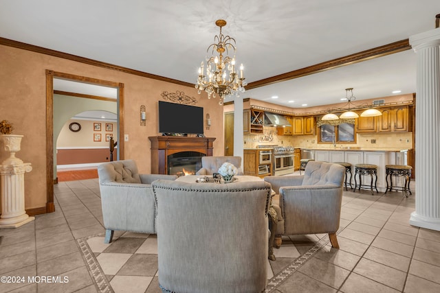 tiled living room featuring an inviting chandelier and ornamental molding