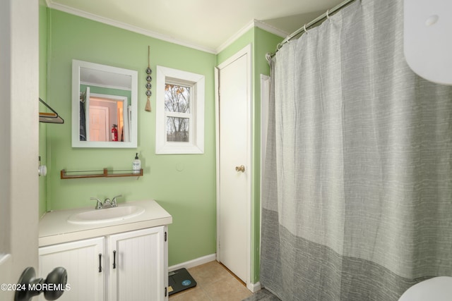 bathroom featuring vanity, tile patterned floors, and ornamental molding