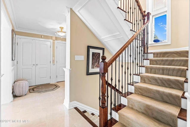 stairway featuring crown molding