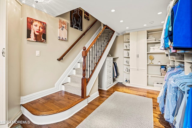 stairs featuring wood-type flooring