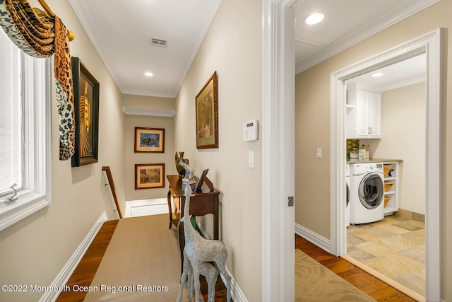 hall featuring hardwood / wood-style floors and crown molding