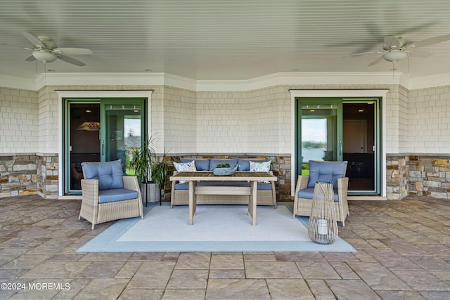 view of patio with outdoor lounge area and ceiling fan