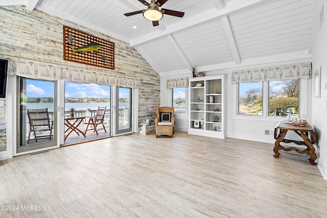 interior space with ceiling fan, beam ceiling, a water view, high vaulted ceiling, and hardwood / wood-style floors