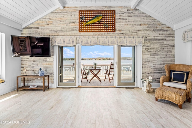 sitting room featuring beamed ceiling, high vaulted ceiling, and light hardwood / wood-style flooring