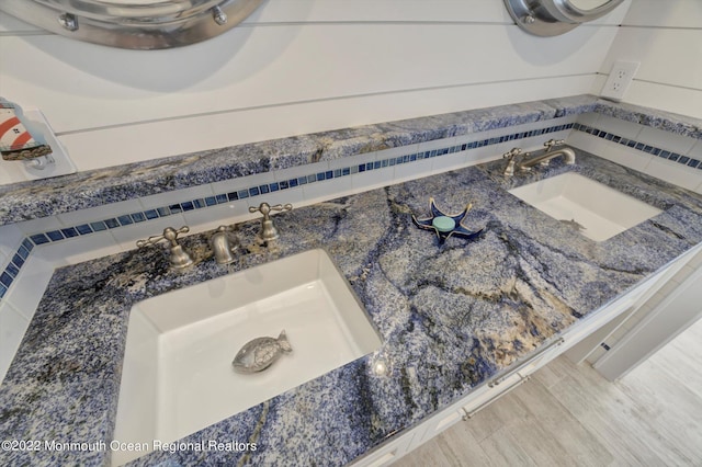 room details featuring hardwood / wood-style flooring and sink