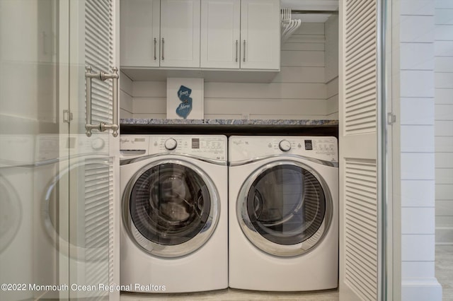 washroom featuring washing machine and dryer