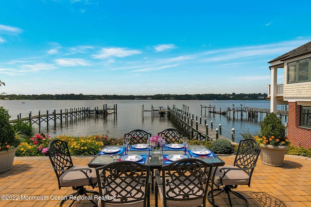 exterior space featuring a water view and a dock