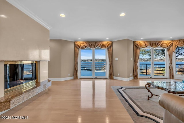 living room with light hardwood / wood-style floors and ornamental molding