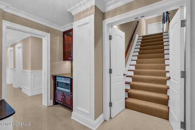 staircase with crown molding