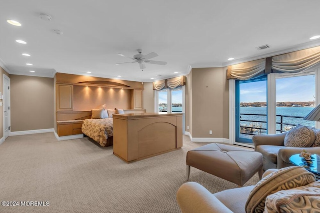 bedroom featuring ceiling fan, crown molding, light colored carpet, access to outside, and a water view