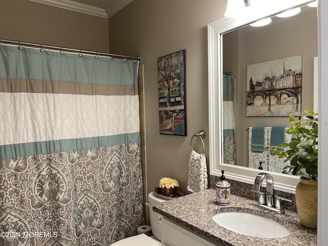 bathroom featuring crown molding, vanity, and toilet