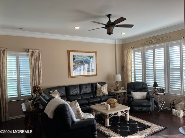 living room with ceiling fan, crown molding, and dark wood-type flooring