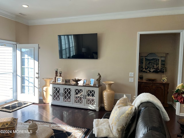 living room with wood-type flooring and crown molding