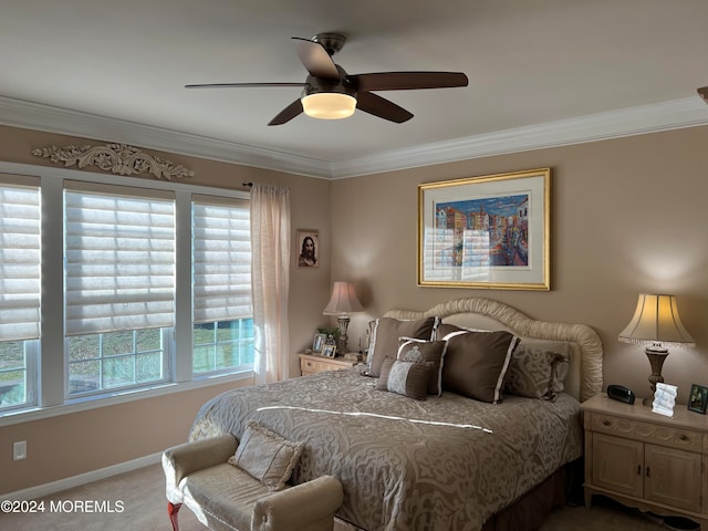 bedroom featuring multiple windows, carpet floors, ceiling fan, and ornamental molding