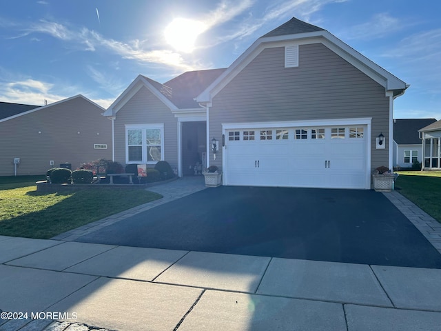 view of front facade with a front lawn and a garage