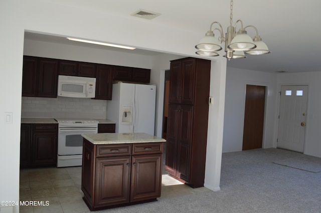 kitchen featuring a center island, an inviting chandelier, light colored carpet, pendant lighting, and white appliances