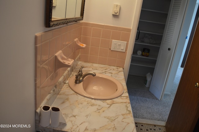 bathroom featuring tile patterned flooring and vanity