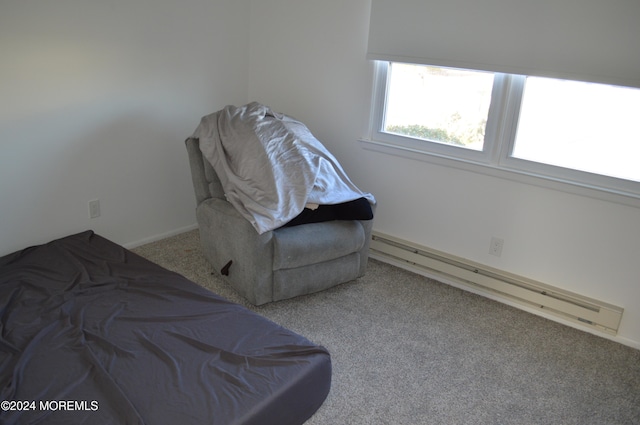 bedroom with carpet flooring and a baseboard radiator