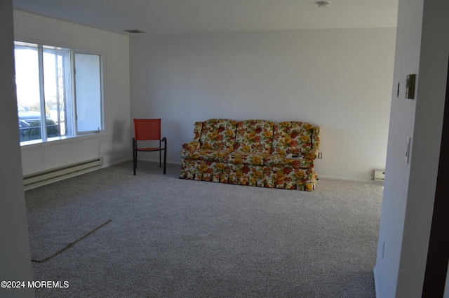 sitting room featuring carpet flooring and baseboard heating