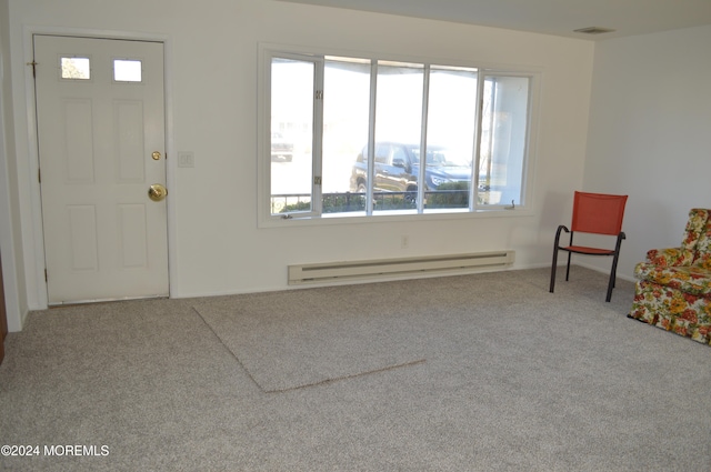 foyer with carpet flooring and a baseboard radiator