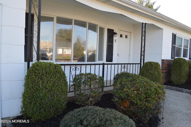 entrance to property with covered porch