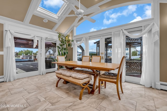 sunroom / solarium featuring french doors, ceiling fan, and vaulted ceiling with skylight