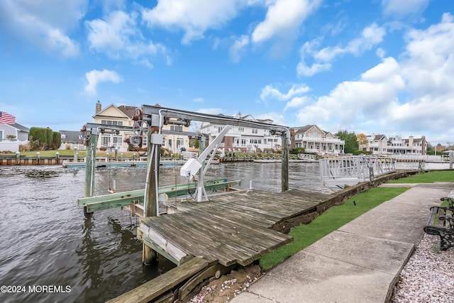 dock area with a water view