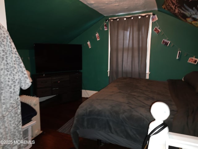 bedroom featuring lofted ceiling