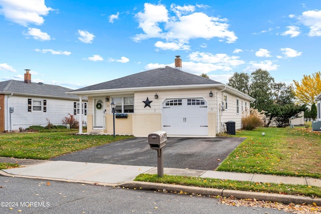 ranch-style house with a front lawn and a garage