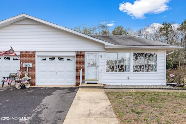 single story home with a garage