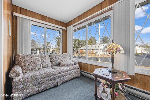 sunroom featuring a baseboard heating unit