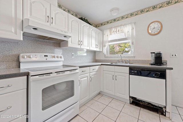 kitchen with sink, light tile patterned floors, backsplash, white appliances, and white cabinets