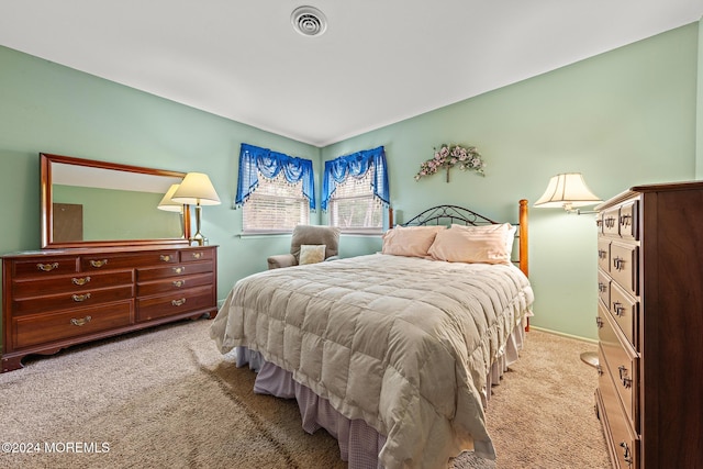 bedroom with light carpet