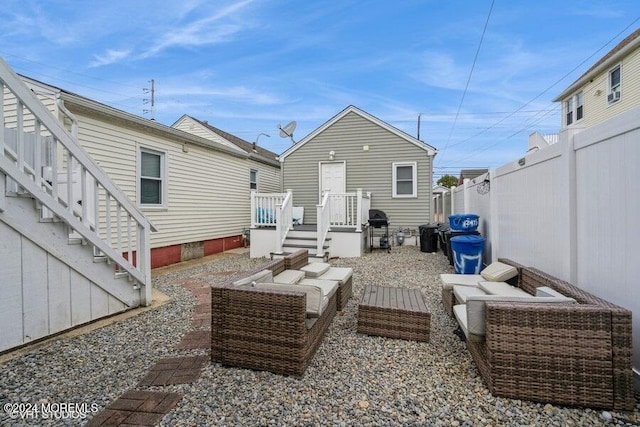 back of property featuring outdoor lounge area and a deck