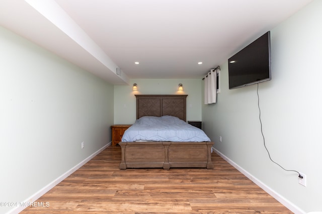 bedroom featuring hardwood / wood-style flooring