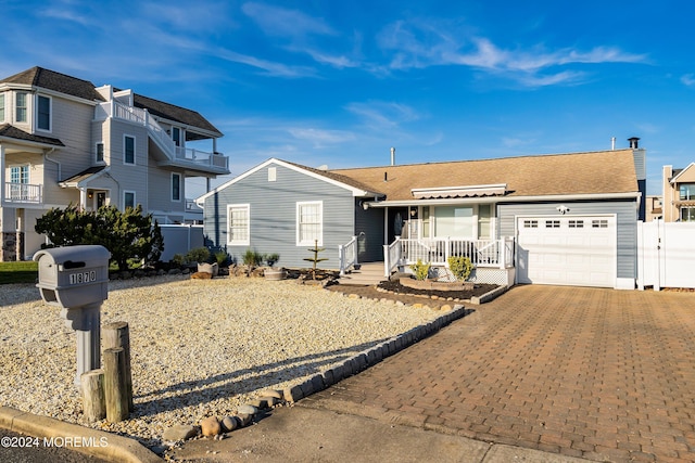 ranch-style house featuring a garage