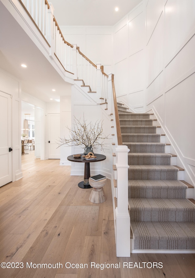 stairway featuring hardwood / wood-style flooring