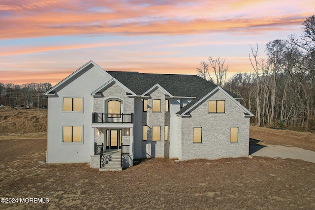 view of front of home with a balcony