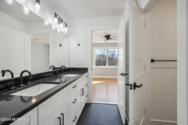 bathroom featuring tile patterned floors, ceiling fan, and vanity