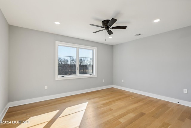 unfurnished room featuring ceiling fan and hardwood / wood-style flooring