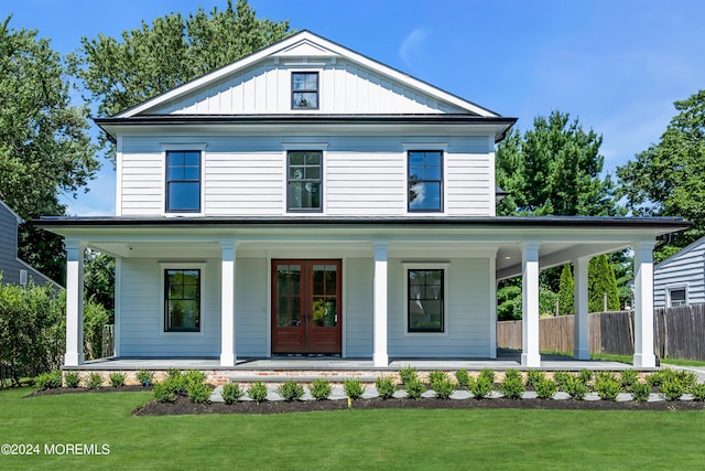 view of front of house with a porch and french doors