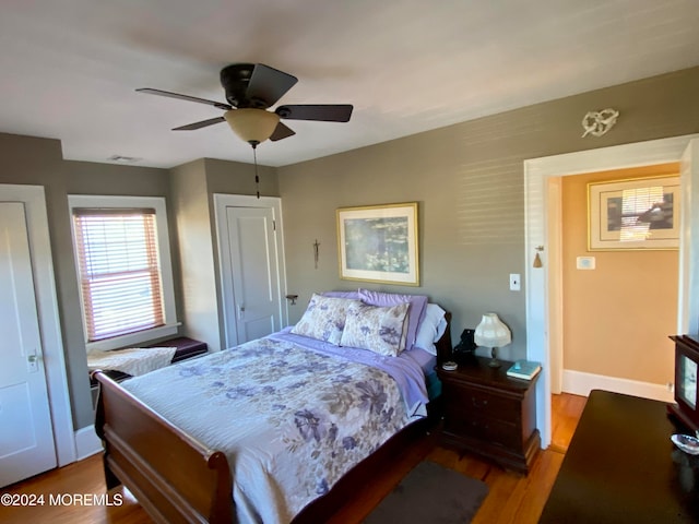 bedroom featuring hardwood / wood-style flooring and ceiling fan