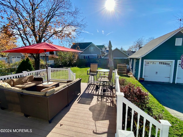 deck with outdoor lounge area and a lawn