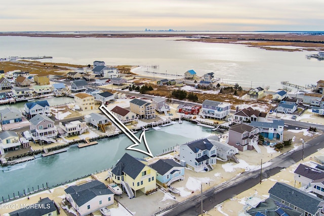 aerial view at dusk with a water view